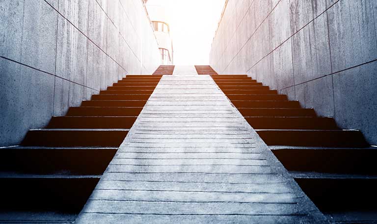 an upward facing view from the bottom of a staircase