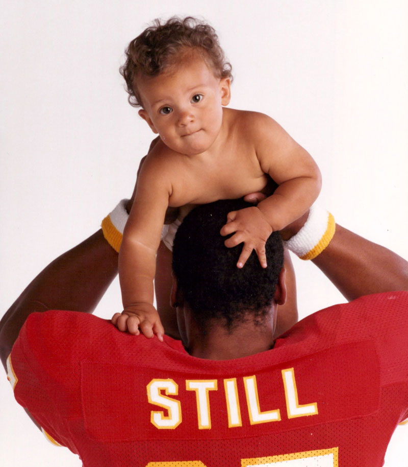 Still poses with his oldest son, Afa (1984).
