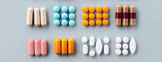 Two rows of pills on a table