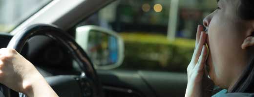 Woman yawning in car