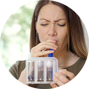 People in scrubs and medical gloves performing a bronchoscopy