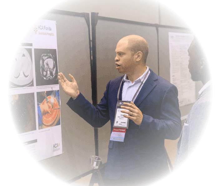 CHEST Annual Meeting attendees discuss a scientific poster