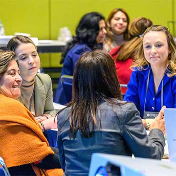 Women at a CHEST 2025 event